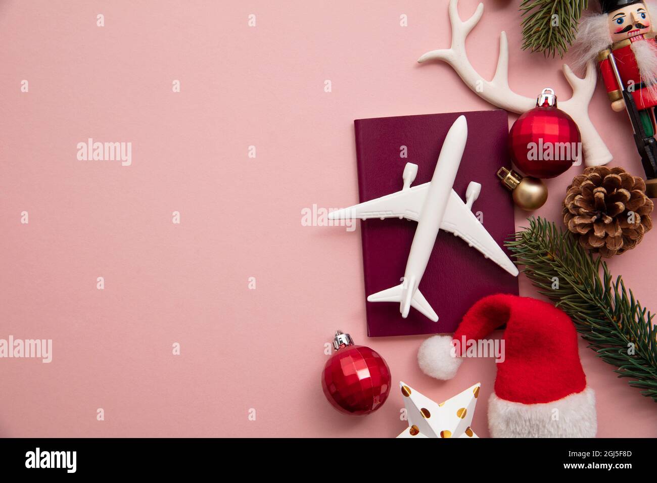 Festive christmas travel background. Airplane with passport and