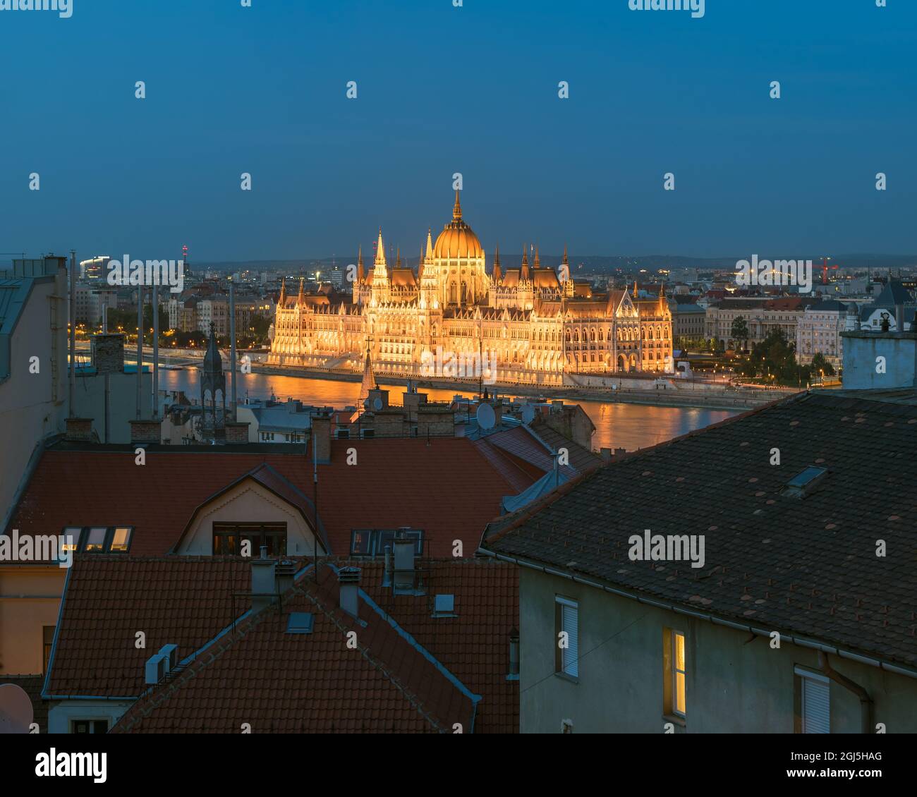 Night citycape about Budapest Hungary included the Hungarian parliament building and Buda flats' roofs.  Unique blue hour photo about the illuminated Stock Photo