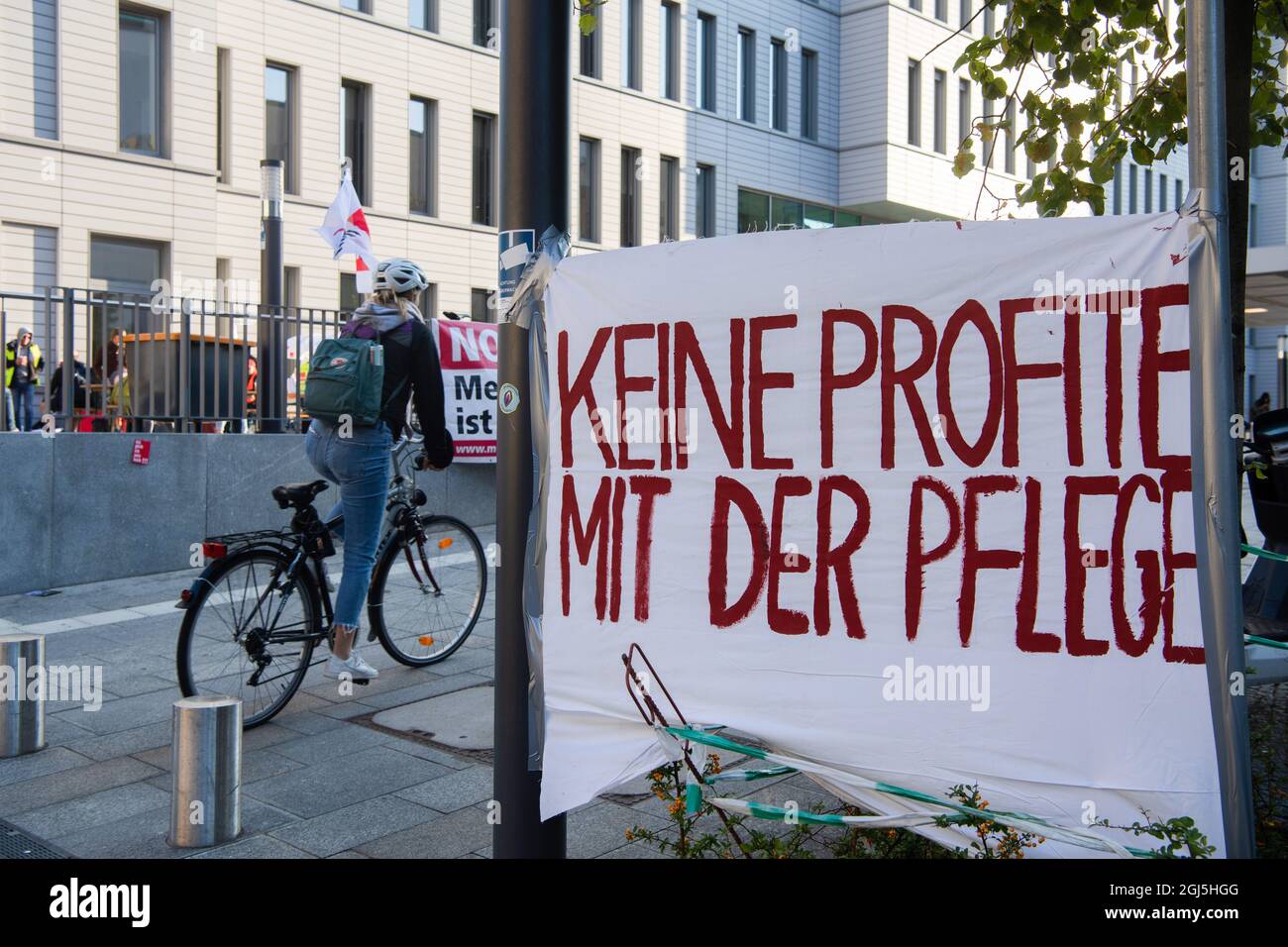 Berlin, Germany. 09th Sep, 2021. 'No profits with nursing' is written on the banner in front of the Charité ward block. There, the employees of the state-owned Berlin hospitals Vivantes and Charité went on an indefinite strike this morning. The trade union Verdi is fighting for collective agreements that will lead to a relief of the employees, for example by setting minimum staffing levels for wards and areas. Credit: Paul Zinken/dpa/Alamy Live News Stock Photo