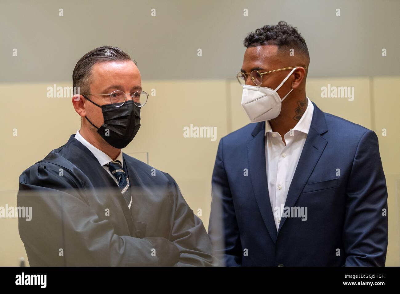 Munich, Germany. 09th Sep, 2021. Professional footballer and former national player Jerome Boateng (r) stands with his lawyer Kai Walden at the beginning of the trial against him at the Munich District Court. Boateng is being tried on charges of assault. Credit: Peter Kneffel/dpa/Alamy Live News Stock Photo