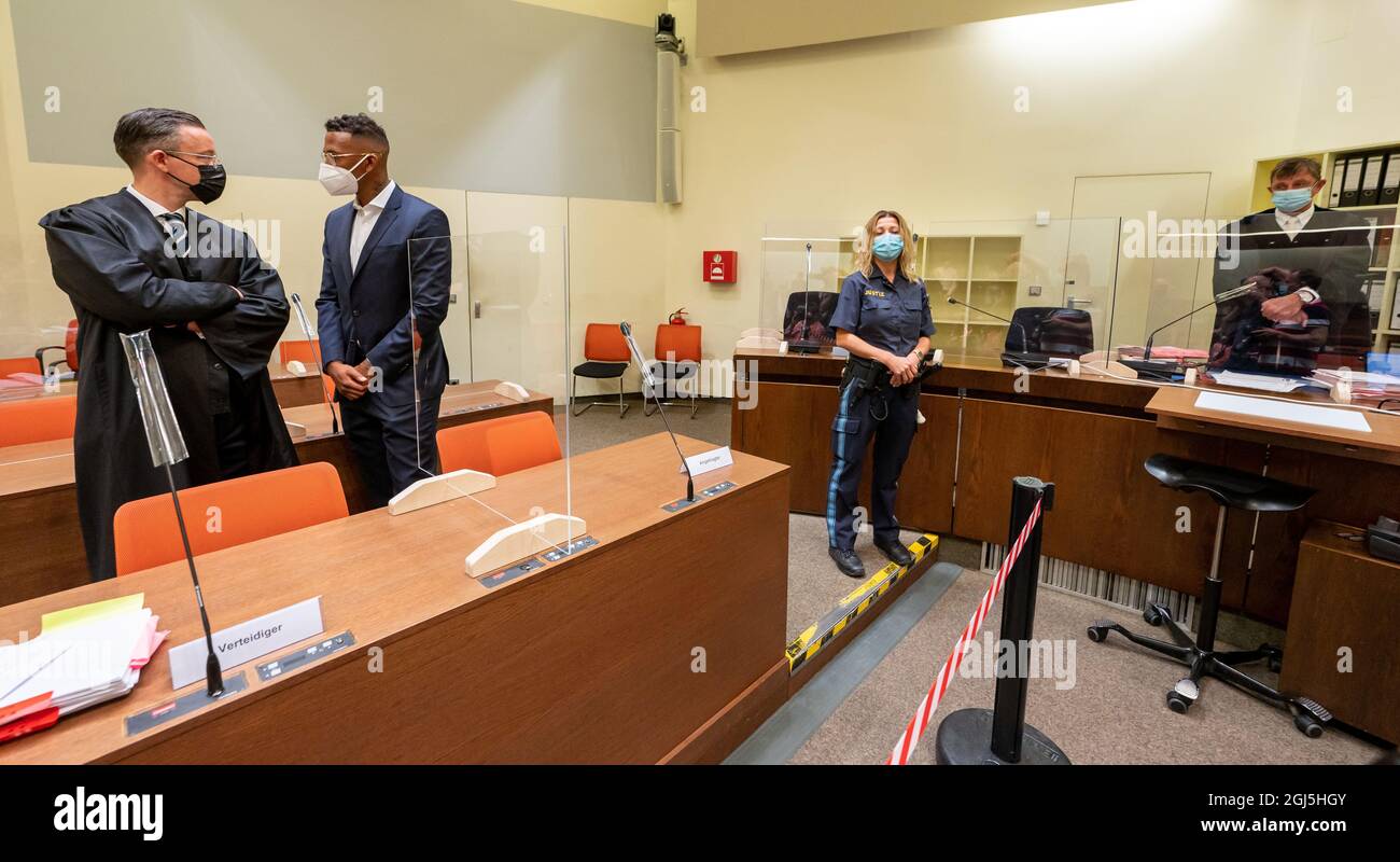 Munich, Germany. 09th Sep, 2021. Professional footballer and former national player Jerome Boateng (2nd from left) stands with his lawyer Kai Walden (l) at the beginning of the trial against him at the Munich District Court. On the right stands district court judge Kai Dingerdissen. Boateng is being tried on charges of assault. Credit: Peter Kneffel/dpa/Alamy Live News Stock Photo