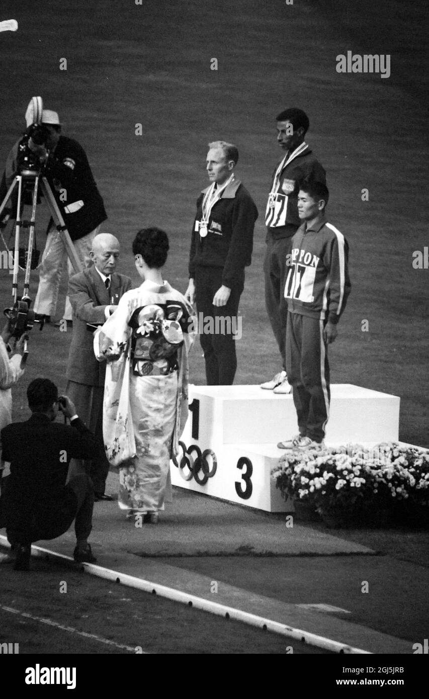 OLYMPICS, OLYMPIC SPORT GAMES - THE XVIII 18TH OLYMPIAD IN TOKYO, JAPAN - ETHIOPIA BIKILA ABEBE ON PODIUM - WINNER OF MARATHON RACE  /  ;  22 OCTOBER 1964 Stock Photo