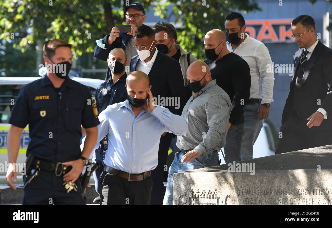 Munich, Germany. 09th Sep, 2021. Professional footballer and former national player Jerome Boateng (M) arrives with bodyguards and court officials for the start of the trial at the Munich District Court in the Criminal Justice Center. He has to answer for the accusation of assault. Credit: Angelika Warmuth/dpa/Alamy Live News Stock Photo