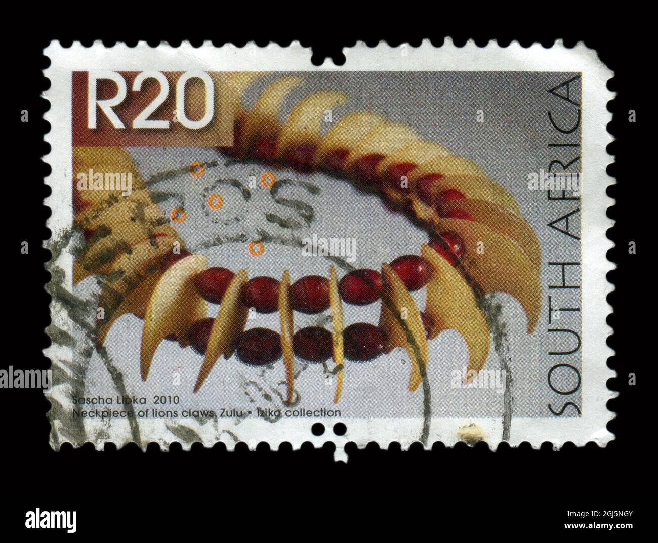 Stamp printed in South Africa shows image of the Neckpiece of lions claws, Zulu, circa 2010. Stock Photo