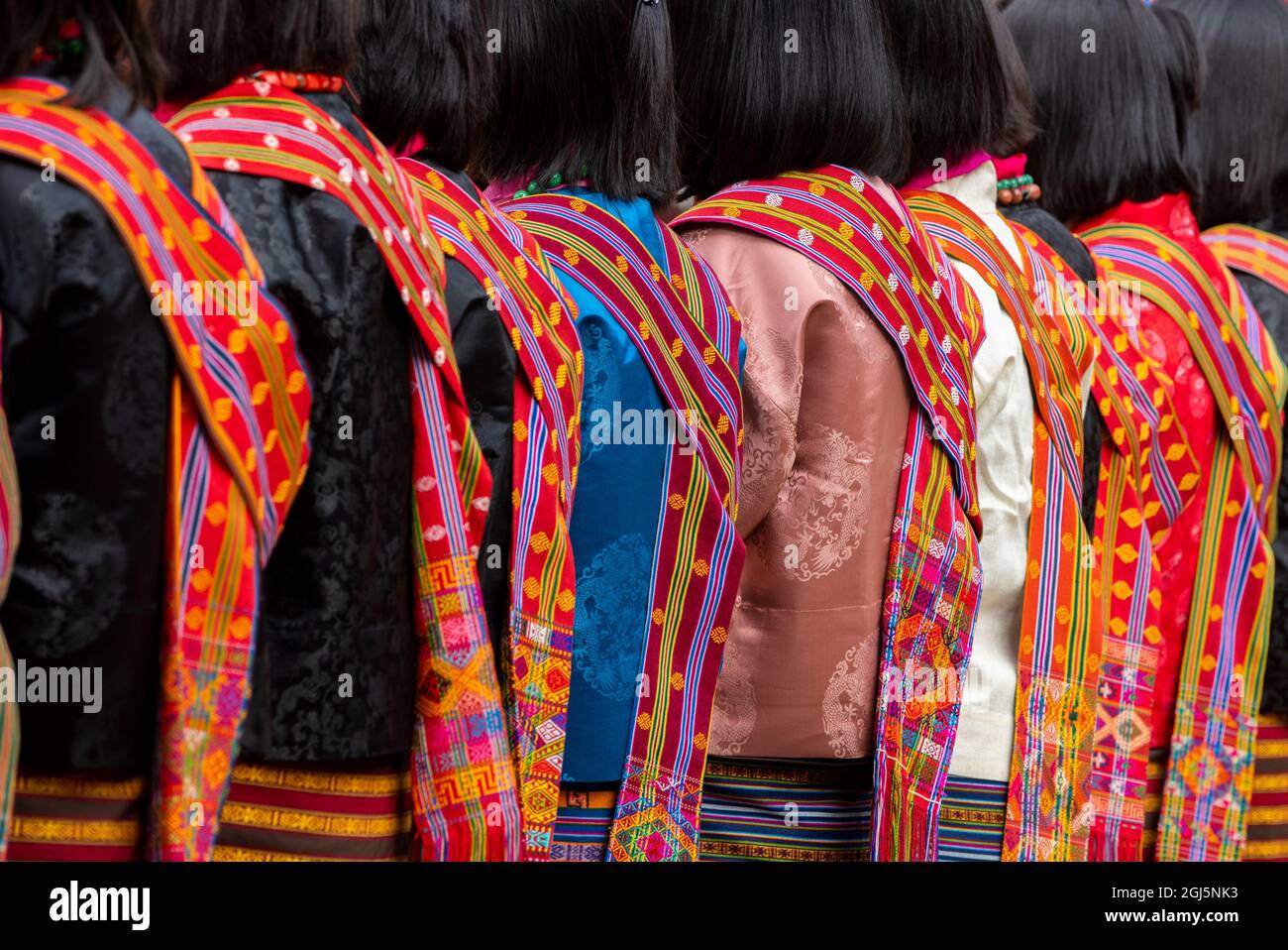 Bhutan, Punakha Dzong. Punakha Drubchen Festival, female dancers in traditional colorful attire. (Editorial Use Only) Stock Photo