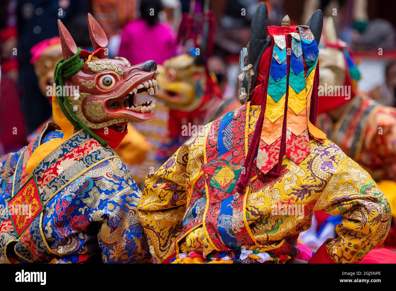 Bhutan, Punakha Dzong. Punakha Drubchen Festival, masked performers in colorful attire. (Editorial Use Only) Stock Photo