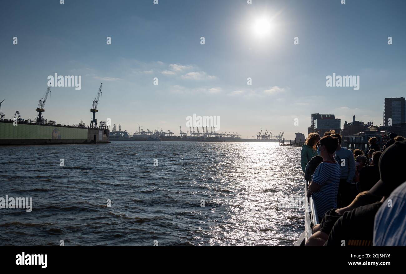 People on a sightseeing boat in the harbor of Hamburg, Germany. Stock Photo
