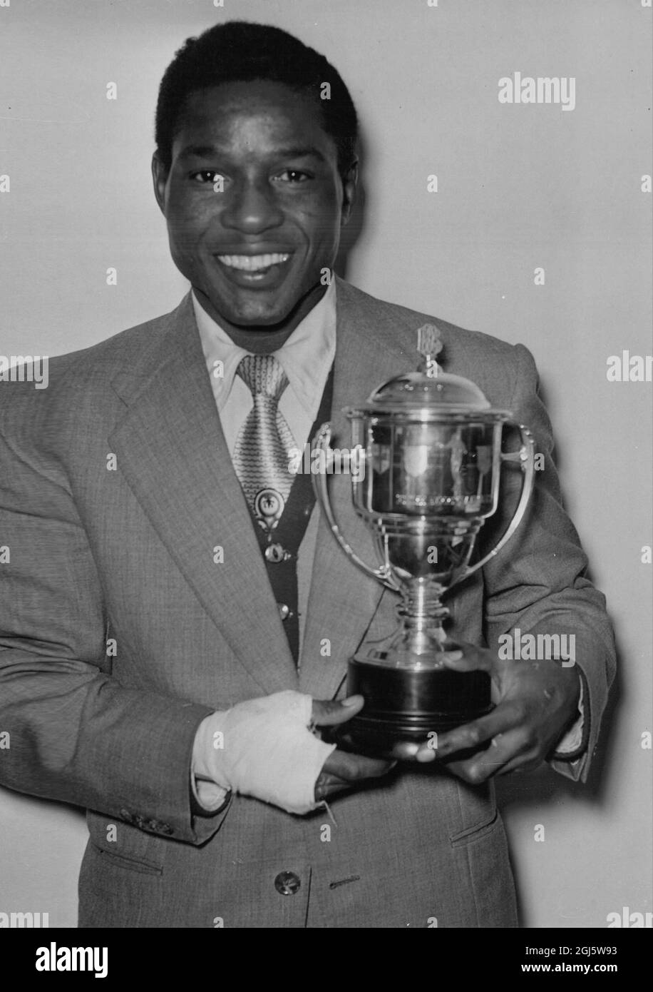 Roy Ankarah with his British Boxing Board of Control silver cup at the British Industries Fair , Earls Court 1st May 1951 Stock Photo