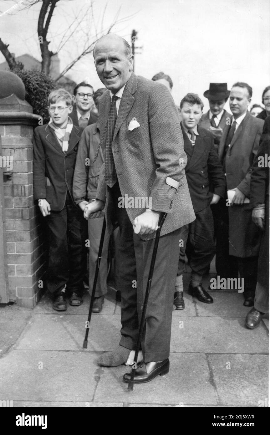 Manchester United manager Matt Busby arrives back in Manchester from Munich , where he has been recovering from injuries received in the air disaster which cost the lives of eight members of his team . 18 April 1958 Stock Photo