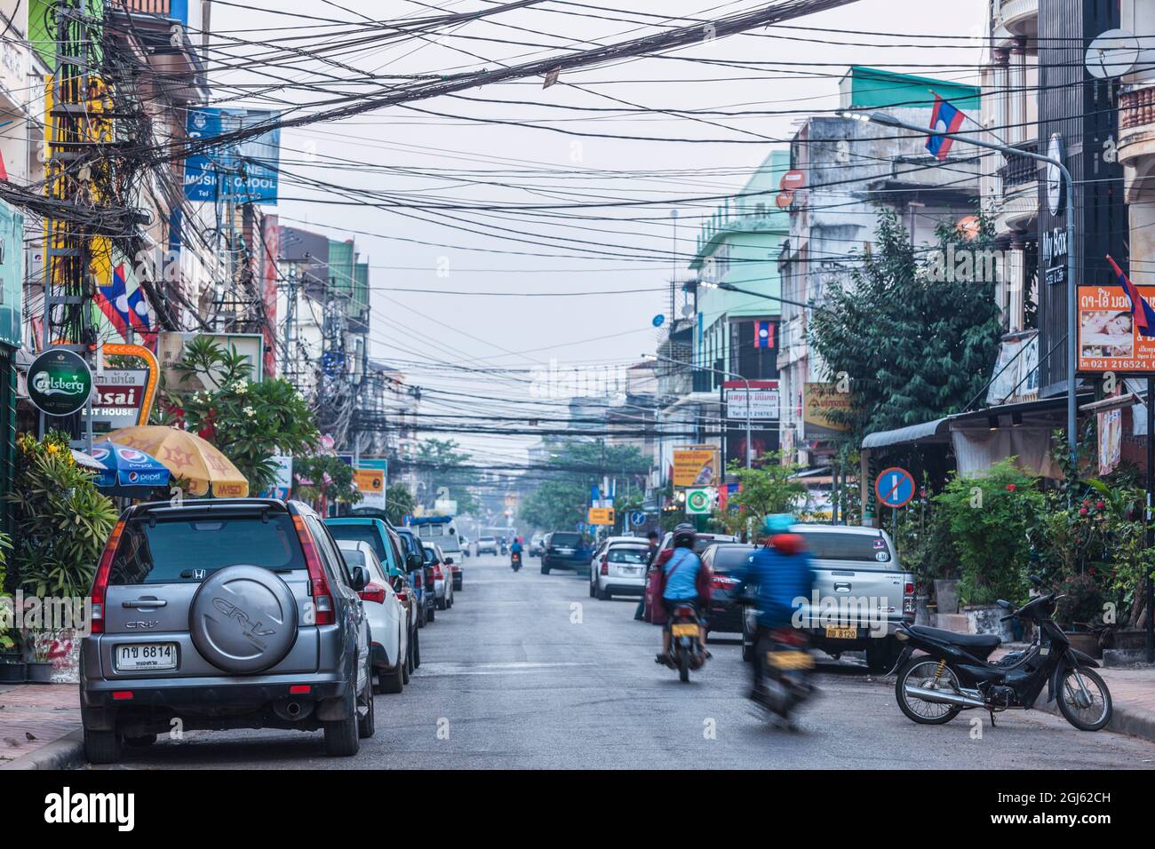 Laos, Vientiane. Downtown traffic at dawn. Stock Photo