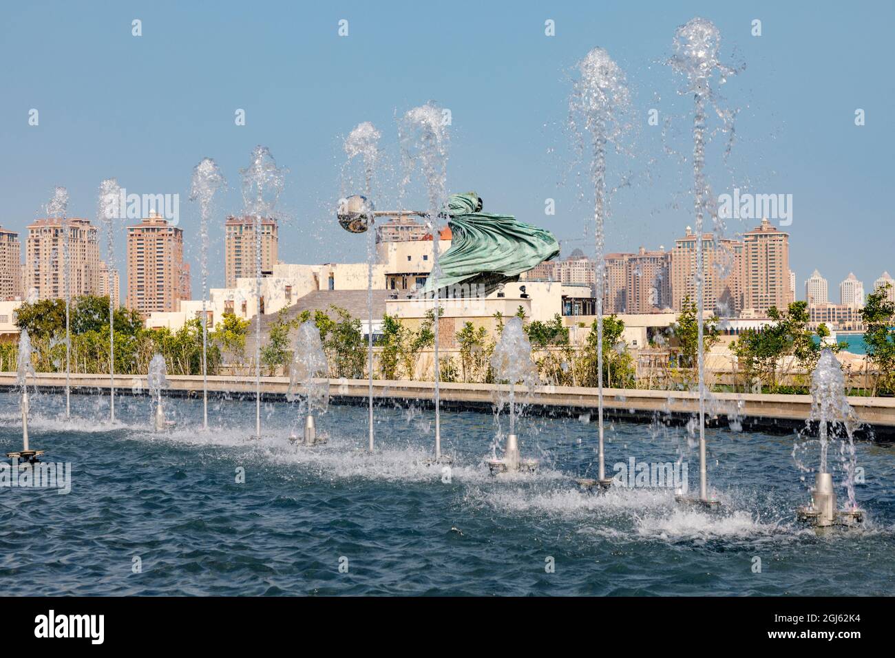 State of Qatar, Doha. The Dancing Fountains. Sculpture called 'Force of Nature' by Italian sculptor Lorenzo Quinn. Katara Cultural Center. (Editorial Stock Photo