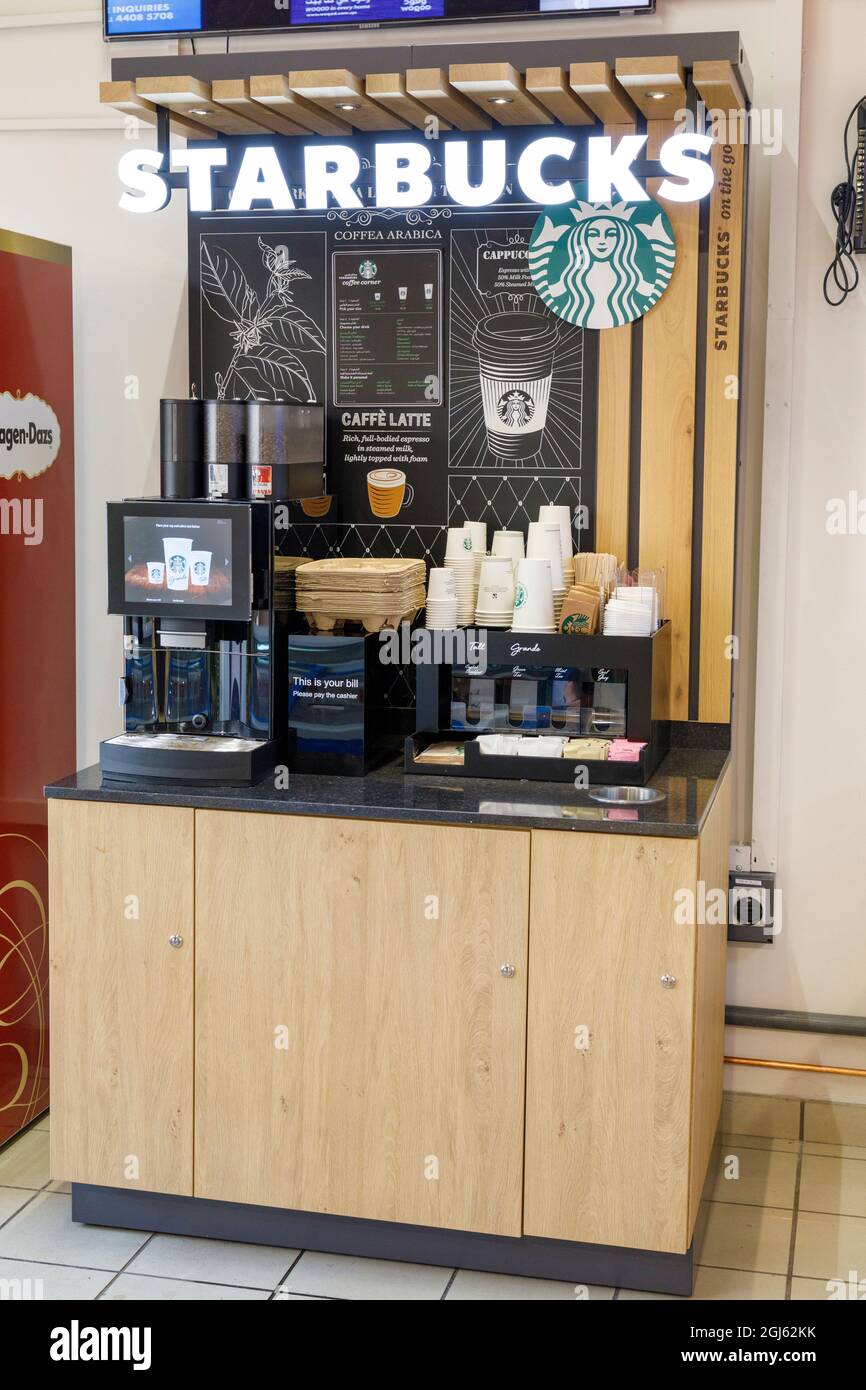 State of Qatar, Doha. Starbucks Coffee stand in fast food convenience store. (Editorial Use Only) Stock Photo