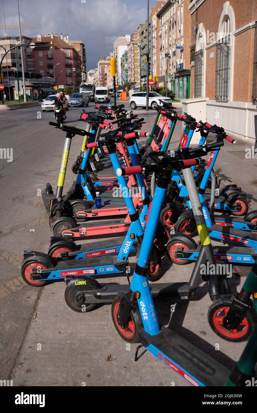 Electric scooters parked in Malaga, Andalusia, Spain Stock Photo - Alamy
