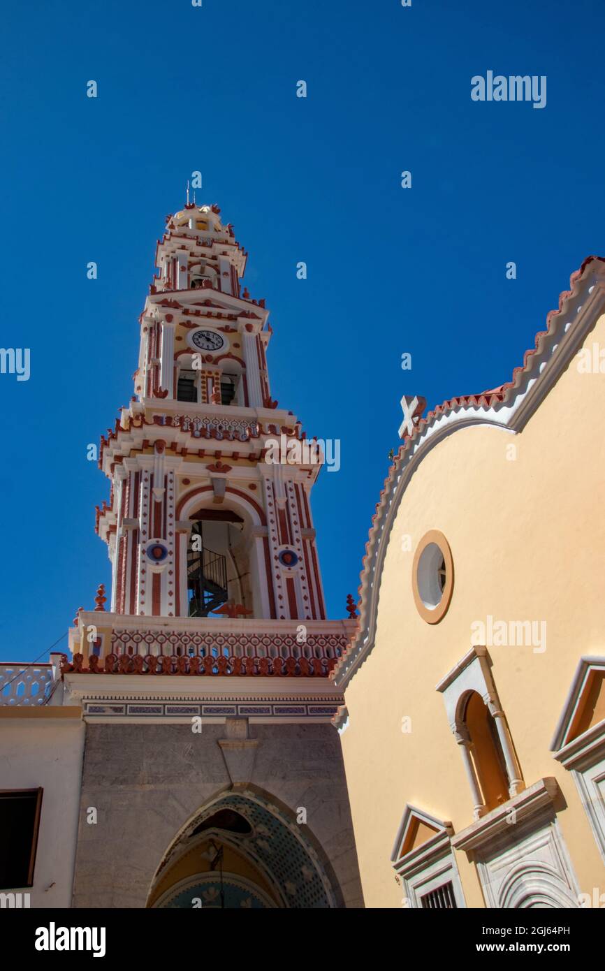 SYMI, Greece - JUN 03, 2021. The church tower of Panormitis Monastery of the Archangel Michael on the island of Symiis one of the tallest Baroque bell Stock Photo