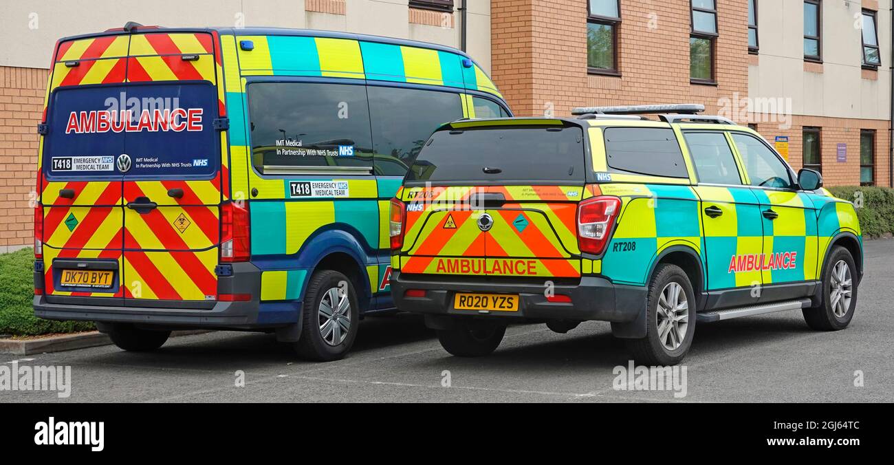 Back & side view two sizes of parked private ambulances operated by IMT Medical Transport healthcare business in partnership to NHS trusts England UK Stock Photo