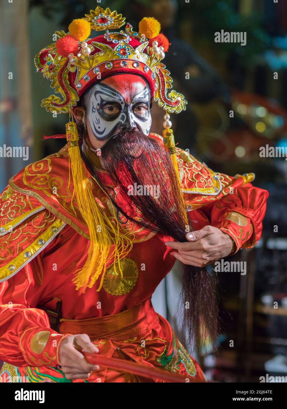 Asia, Vietnam, Hanoi, old quarter. Dancer with face paint and false beard. (Editorial Use Only) Stock Photo