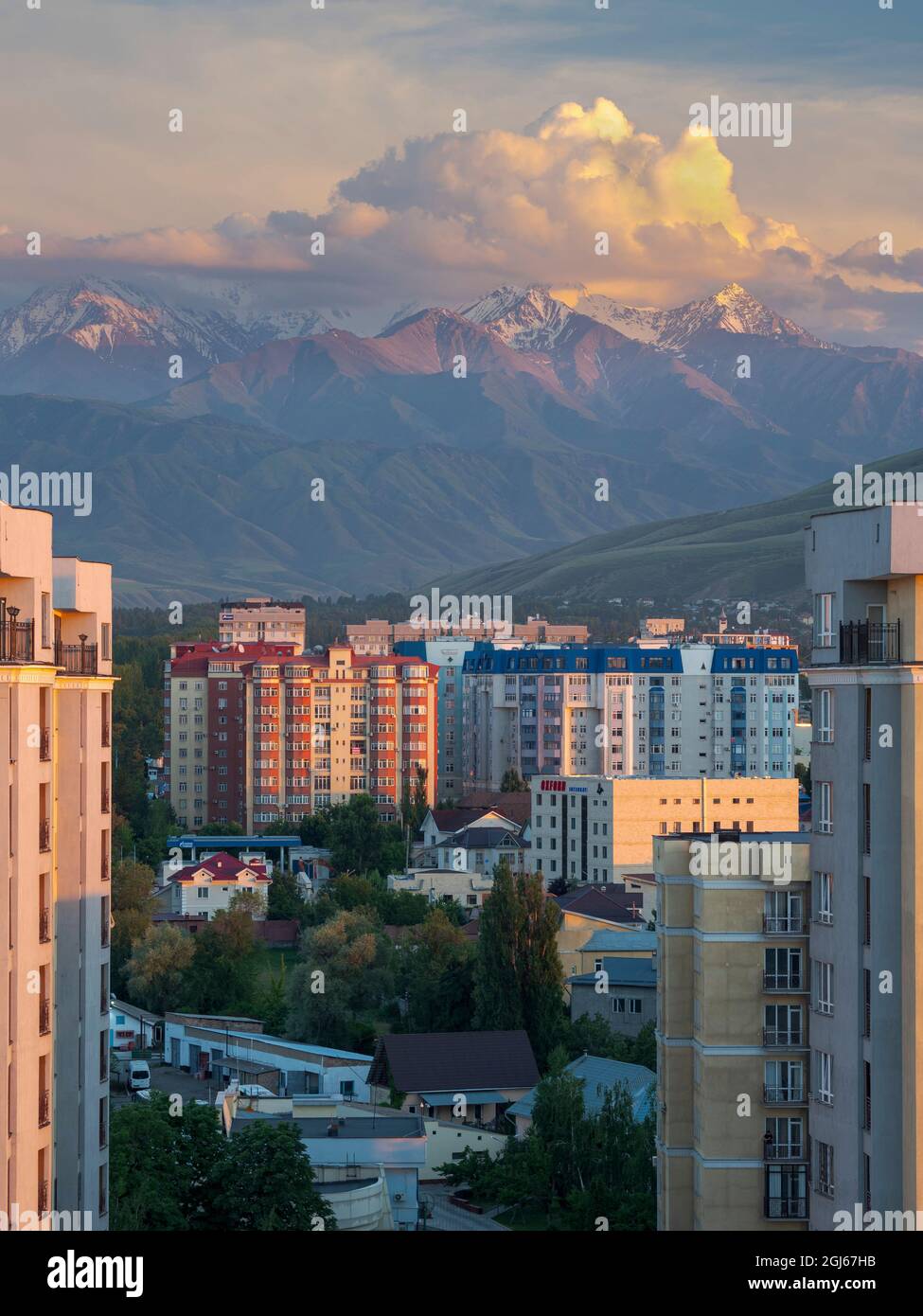 City view with modern high rise buildings, background the mountains of ... - High Rise Buildings In Bishkek