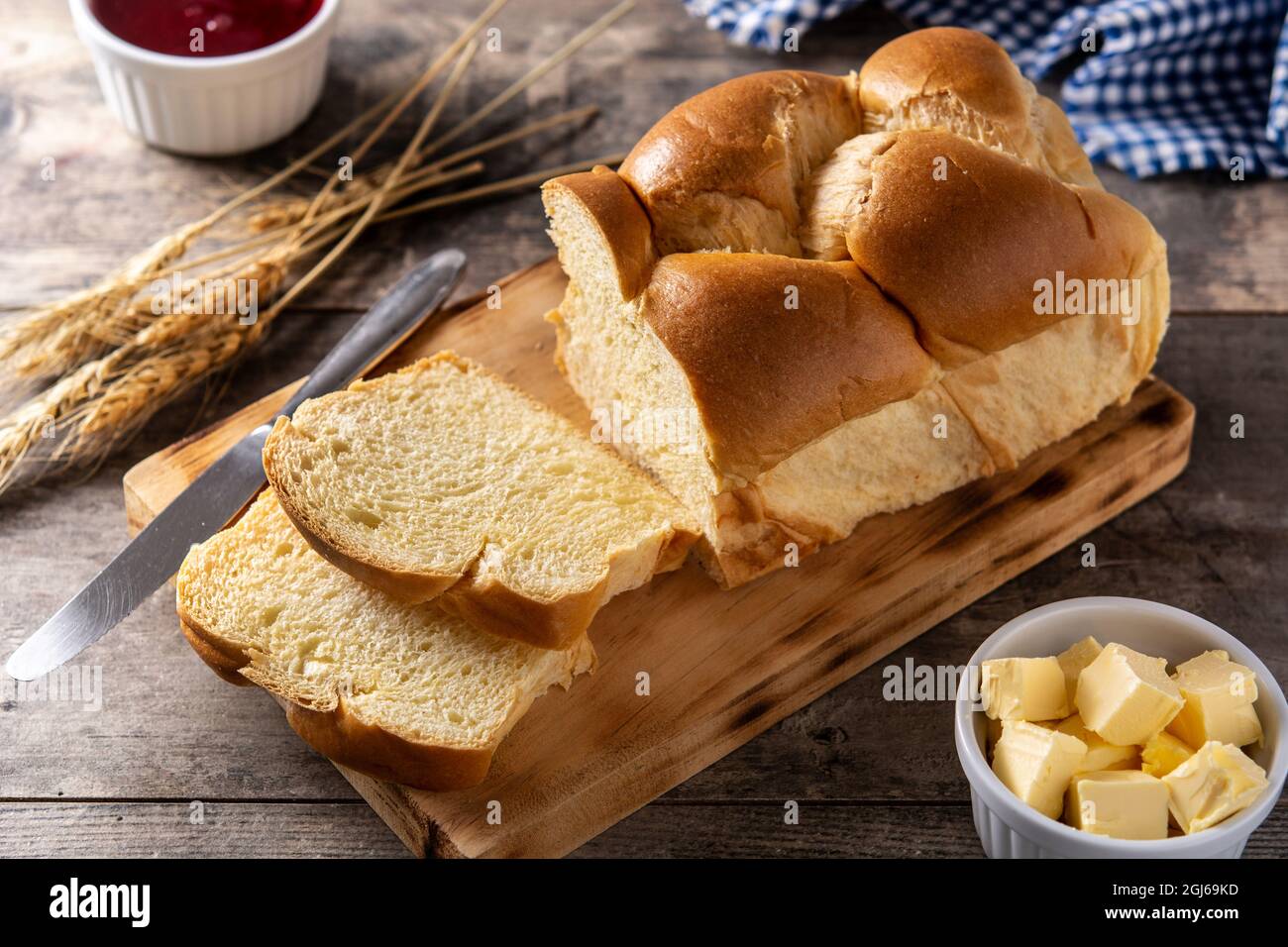 Braided egg bread on wooden table Stock Photo
