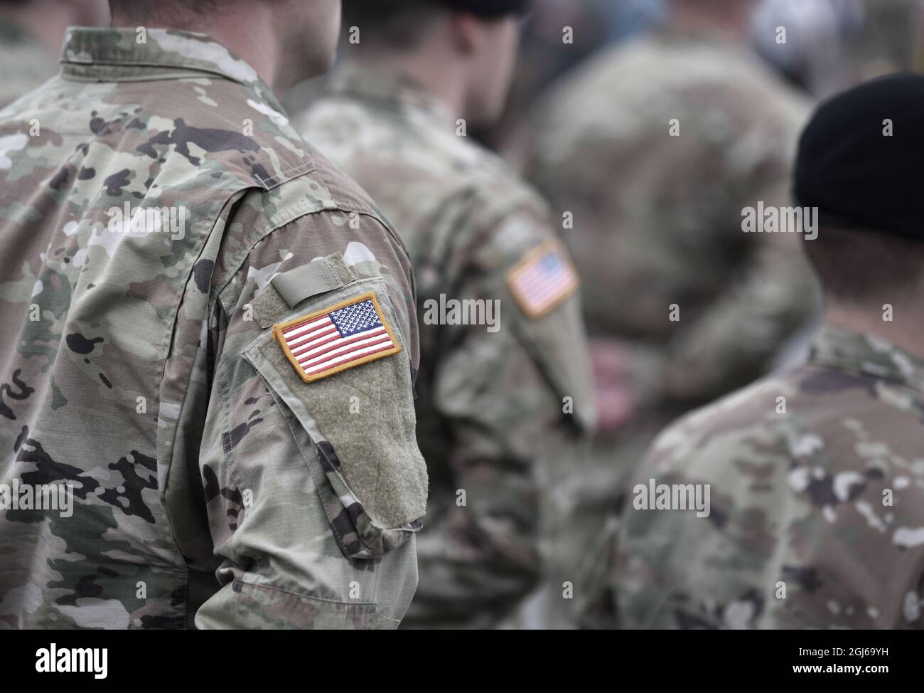 US soldiers. US army. USA patch flag on the US military uniform. Soldiers on the parade ground from the back. Veterans Day. Memorial Day. Stock Photo