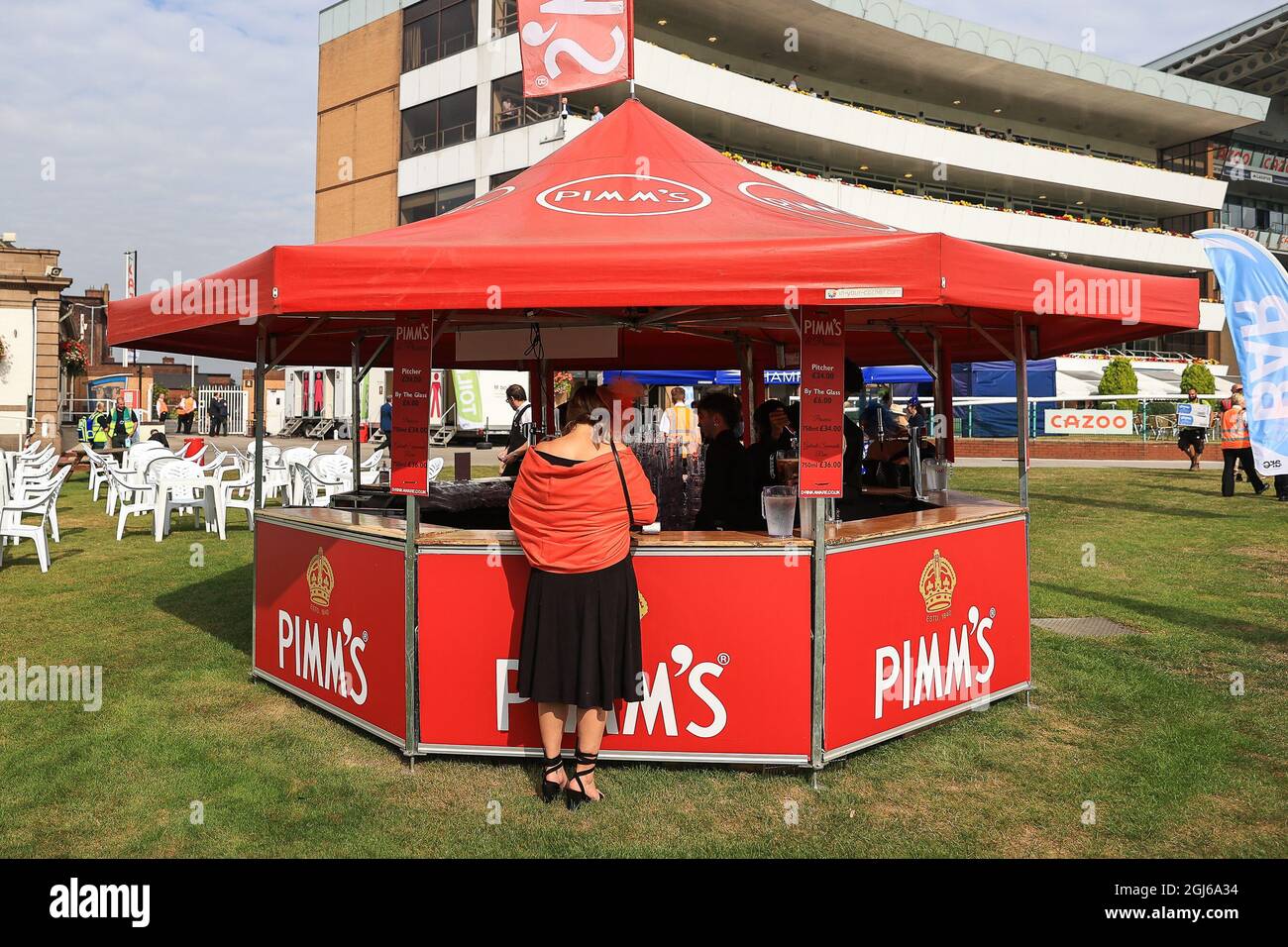 Lady’s queues at the Pimm’s bar at the St Leger Festival 2021 at Doncaster Racecourse Stock Photo