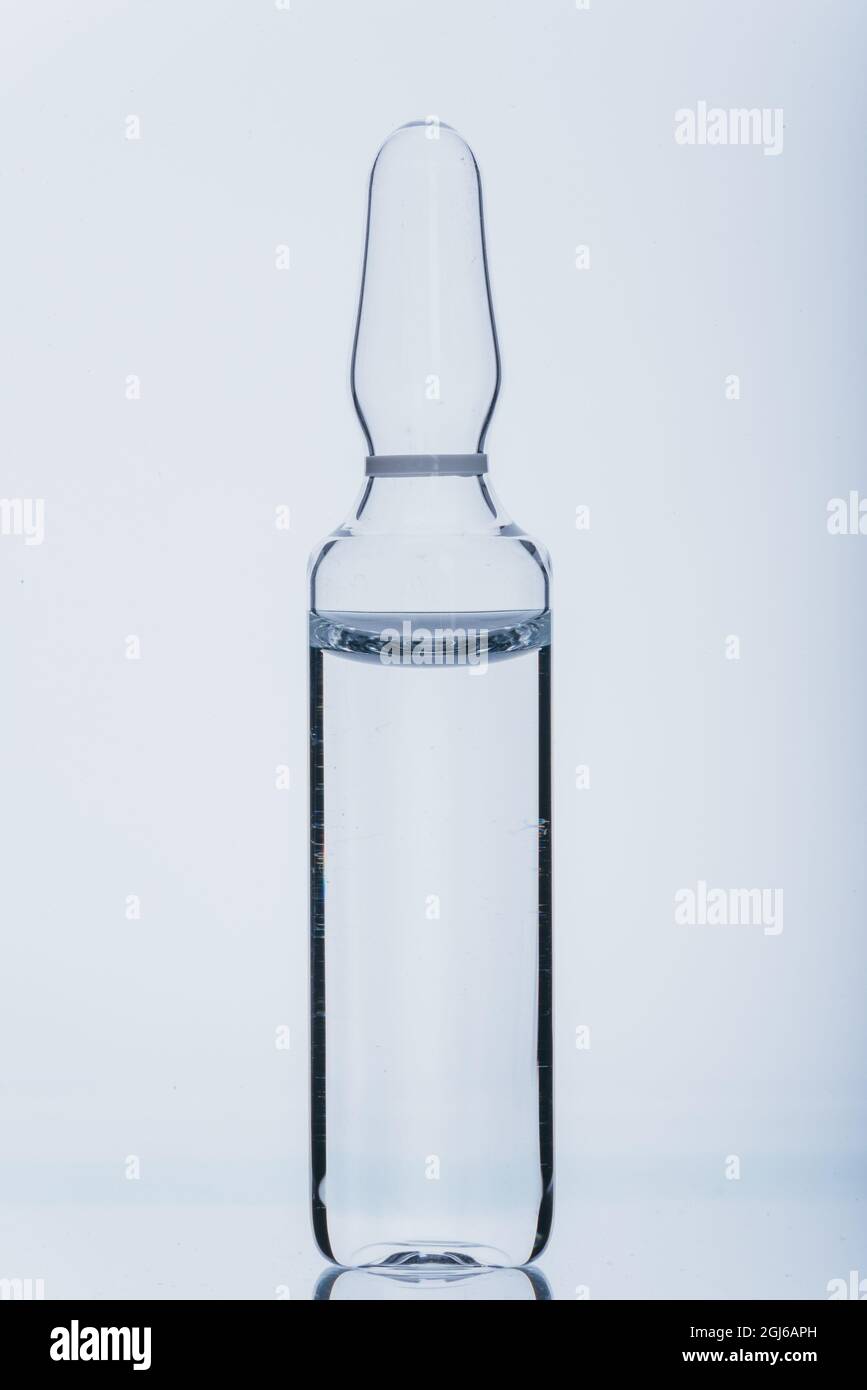 Glass medical ampoule vial for injection. Medicine is dry white drug