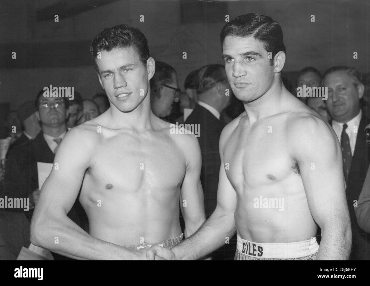 Terry Downes (left) boxer shaking hands with opponent Phil Edwards of