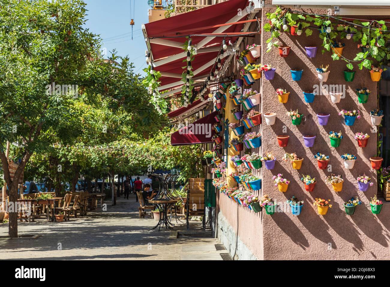 Armenia. Yerevan. Flower pots on the wall of a shop in the Tashir