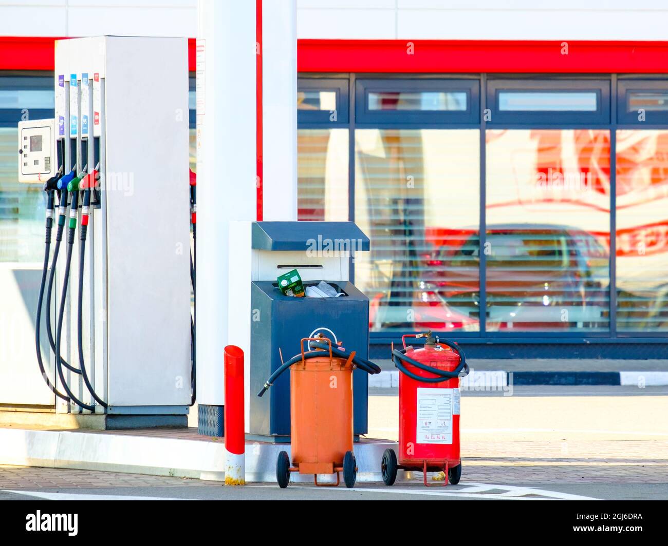 Handheld fire extinguishers at gas stations to prevent fires. Primary