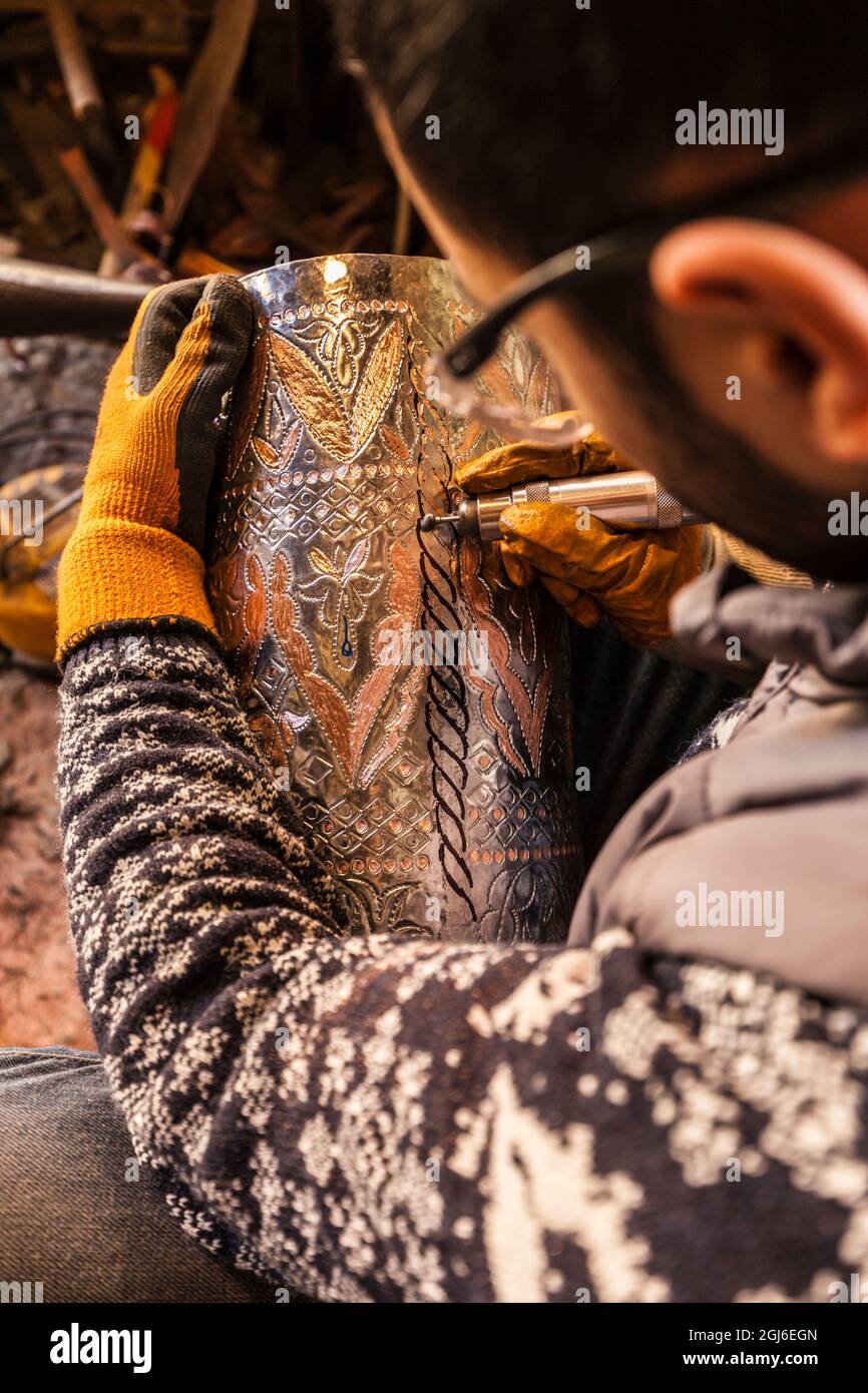 Azerbaijan, Lahic. Metalworker engraving. (MR) Stock Photo