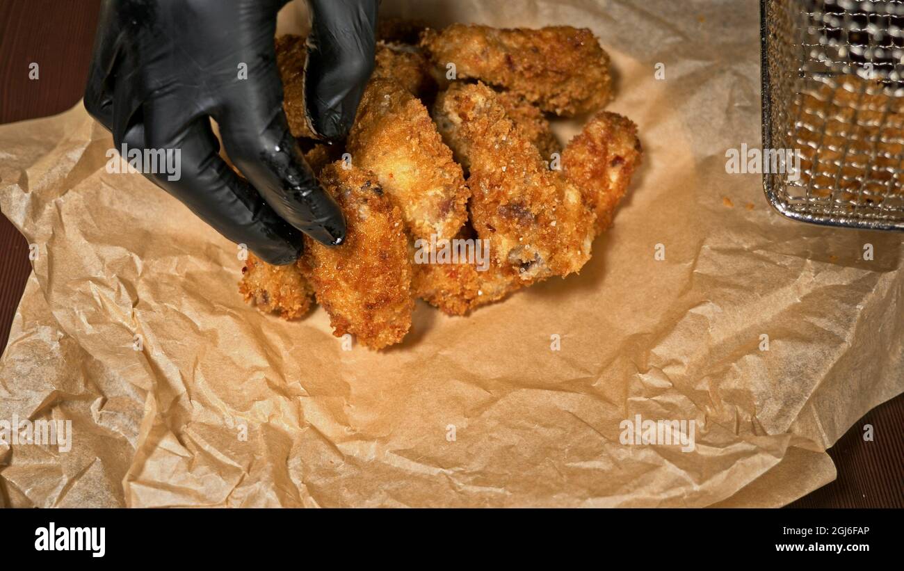 Cool beautiful fresh juicy cooked chicken wings in breading. Buffalo