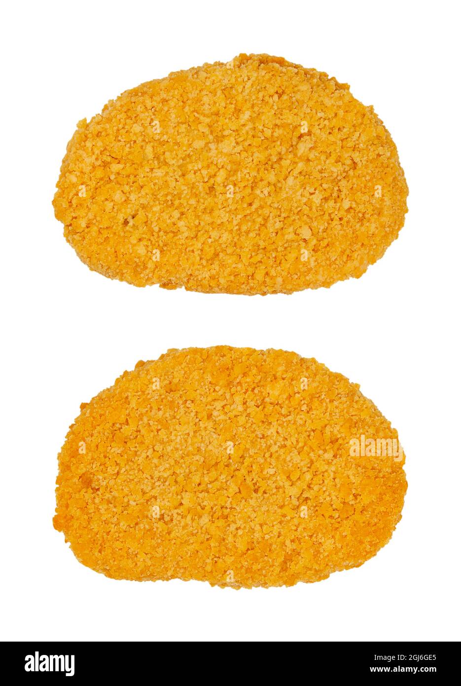 Two vegan breaded cutlets, from above, isolated on white background. Two slices of pre-fried schnitzel, based on soy protein, a meat substitute. Stock Photo