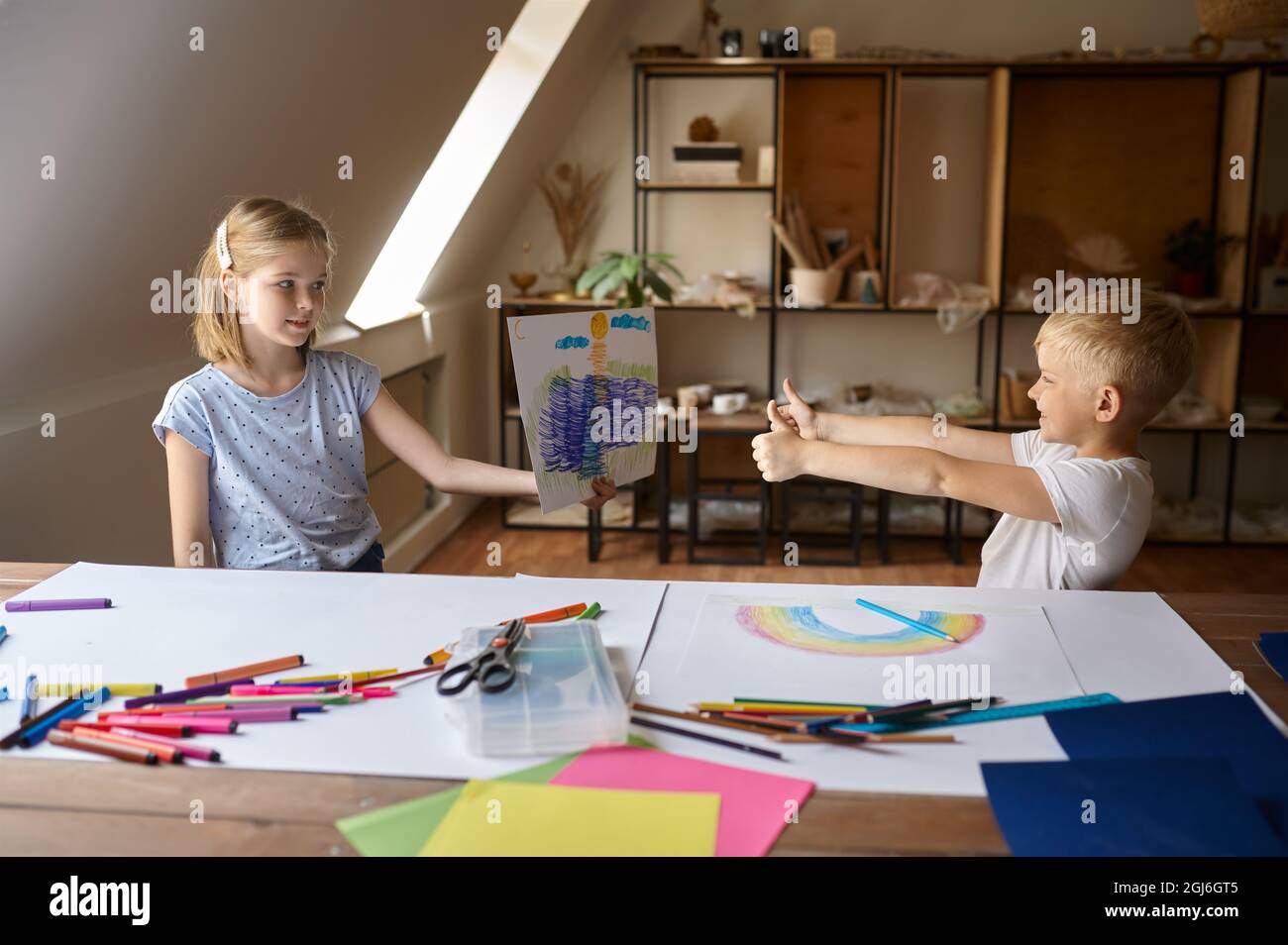Two children at the table in drawing class Stock Photo - Alamy