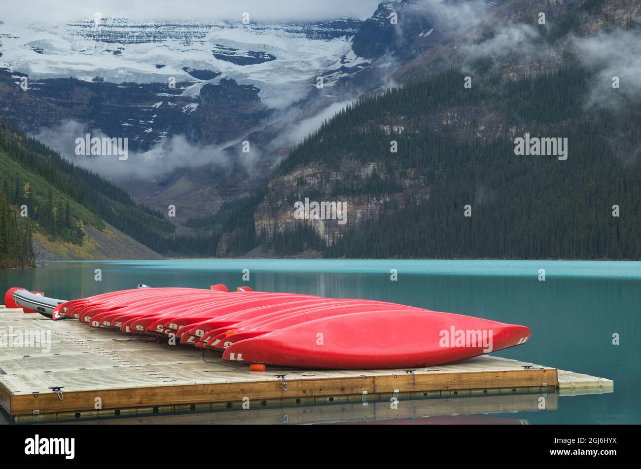 Banff Dock Canada, Alberta. Red canoes on dock, Lake Louise, Banff National Park ...