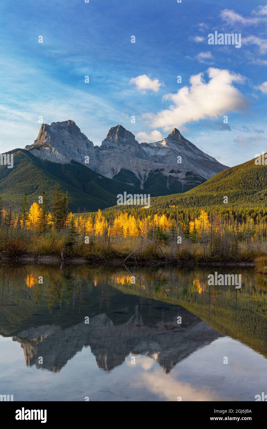 Three Sisters reflect into pool in Canmore, Alberta, Canada Stock Photo ...
