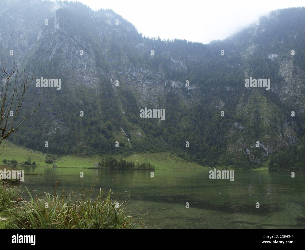 Beautiful landscape with a calm lake and majestic mountains in