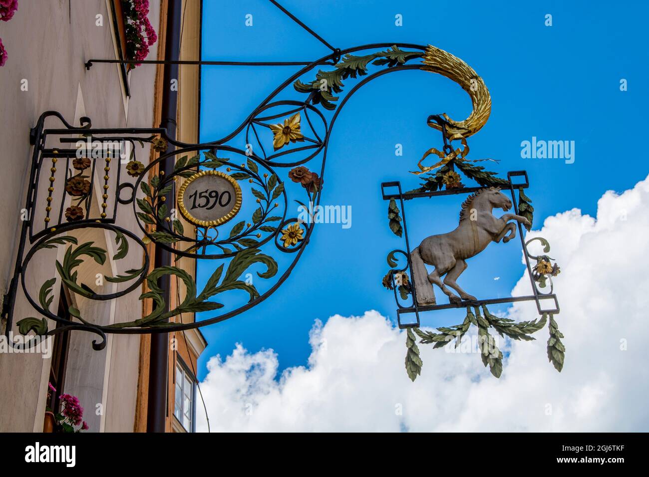 Wrought iron hanging signs hi-res stock photography and images - Alamy