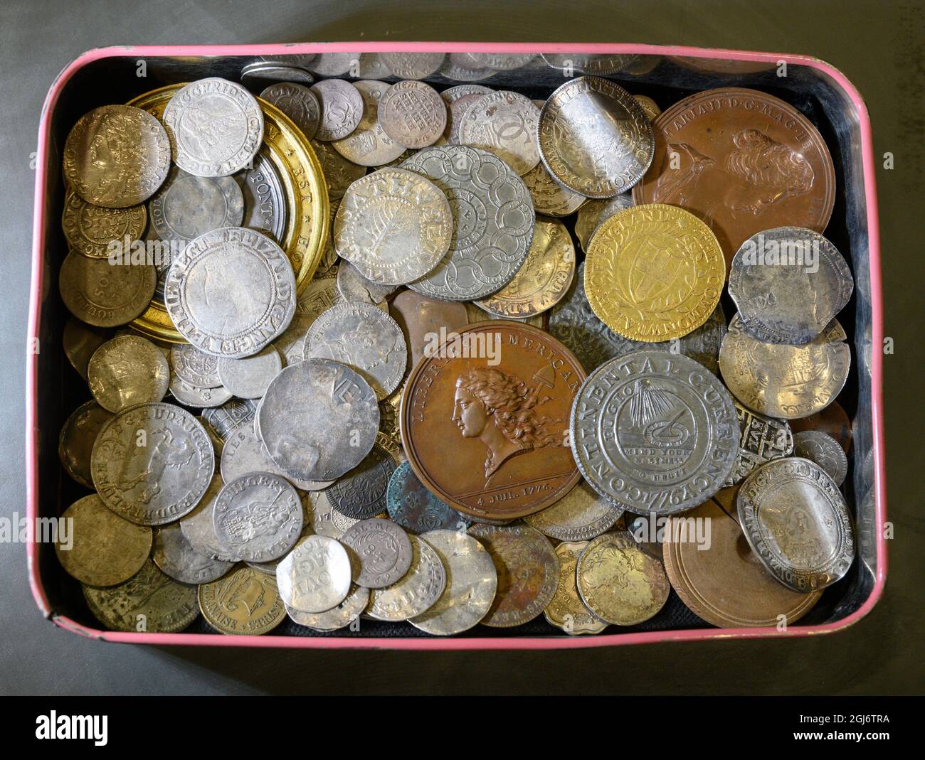 Morton & Eden, London, UK. 9 September 2021. A vintage sweet tin of coins  in Morton & Eden's Autumn sale includes several interesting early pieces  from the American Colonial period. An ancestor