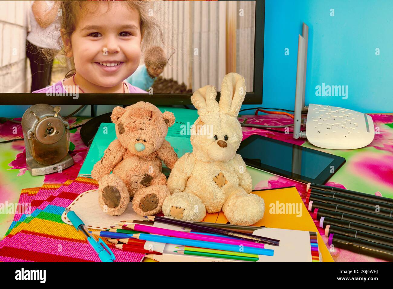 Plush animal toys on school supplies Stock Photo