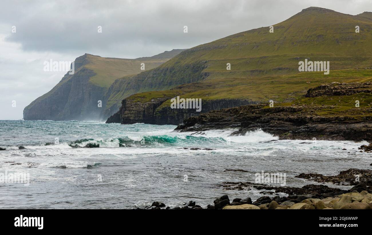 Europe, Faroe Islands. View of the northern coast pounded by storm surf from the village of Eidi on the island of Eysturoy. Stock Photo