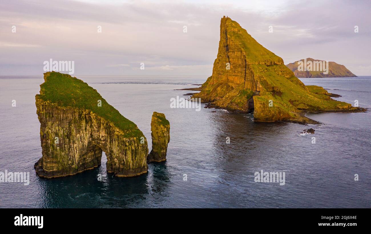 Europe, Faroe Islands. Aerial view of Drangarnir and Tindholmur off the ...