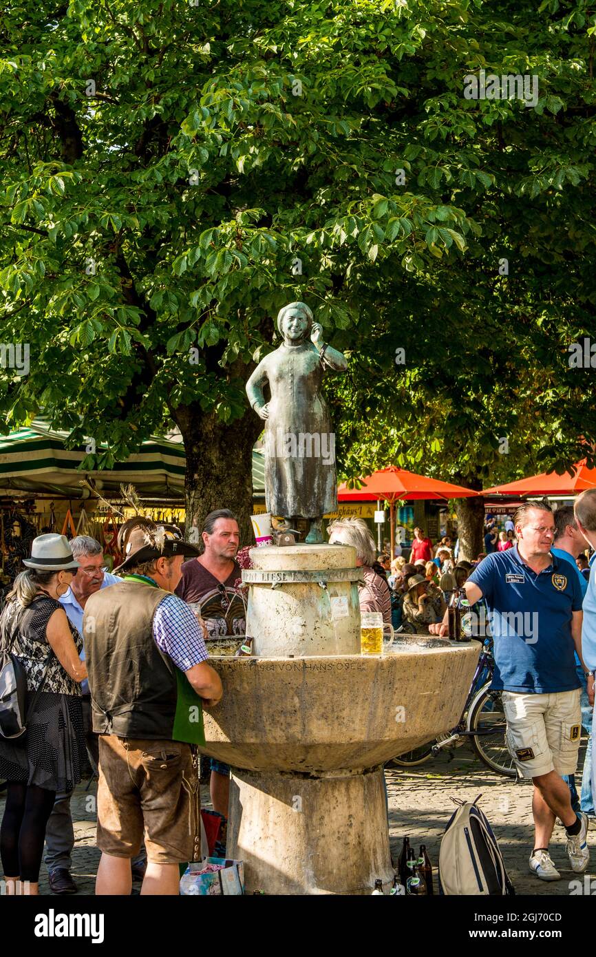 The Liesl Karlstadt Fountain in the Viktualienmarkt a central food or farmers market, Munich, Bavaria, Germany. Stock Photo