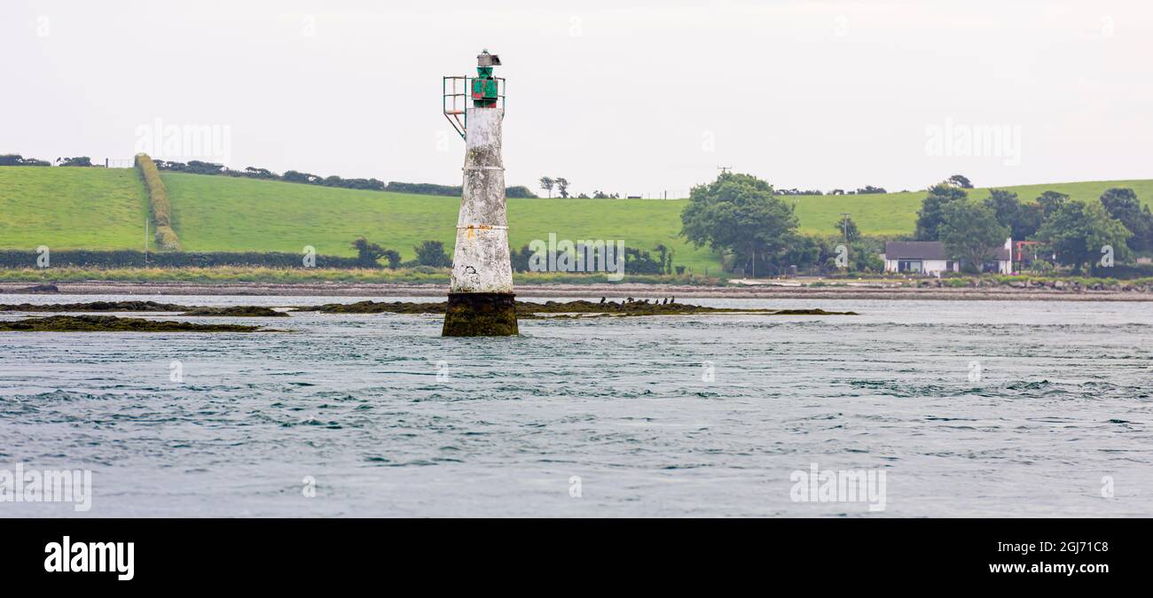 Conical concrete shipping navigation aid by the coast of Strangford Lough, County Down, Northern Ireland Stock Photo