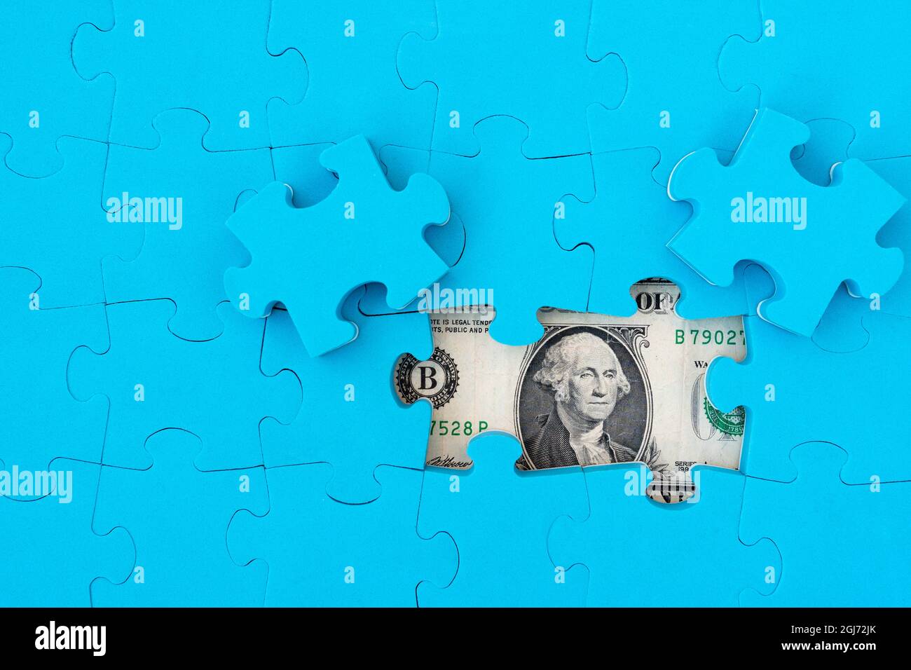 Dollar puzzle, business concept of solution. Dollar bill and puzzle