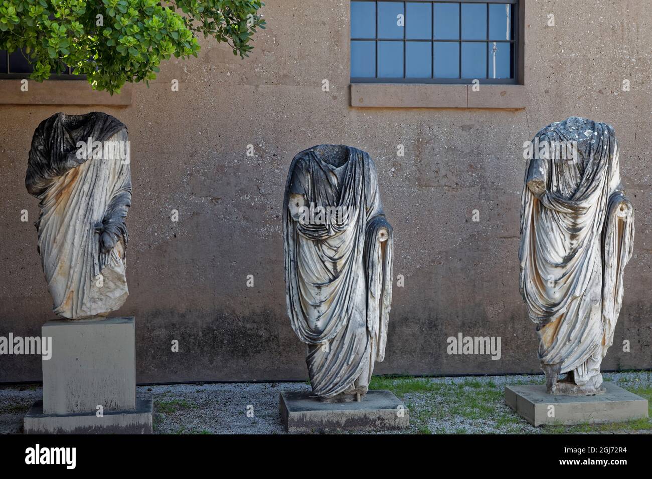 Greece, Corinth. Headless statues outside museum. Credit as Dennis