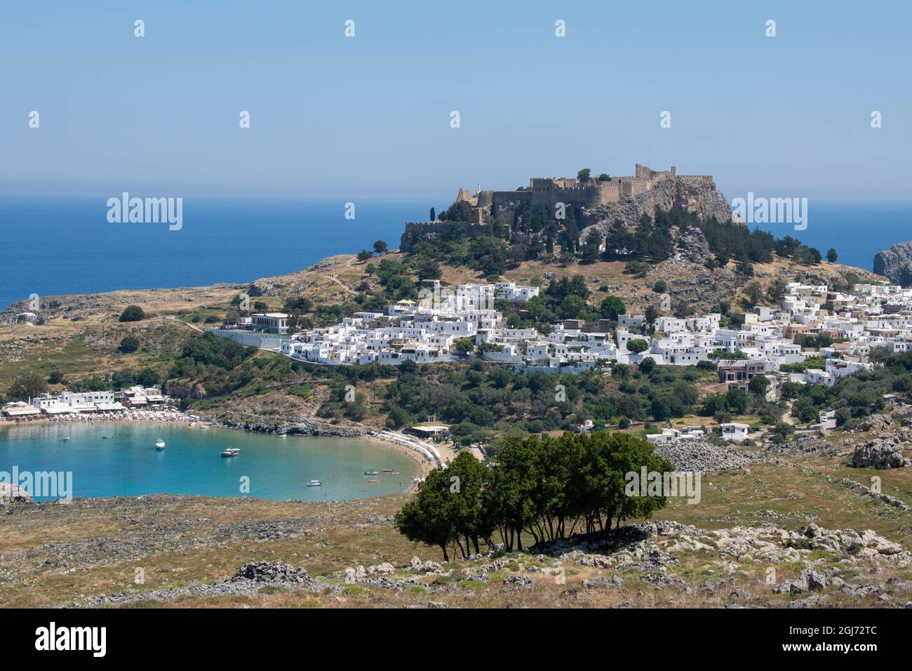 Greece, Rhodes. Historic Lindos, scenic view of Acropolis of Lindos and the ruins of Temple of Athena Lindia. Stock Photo