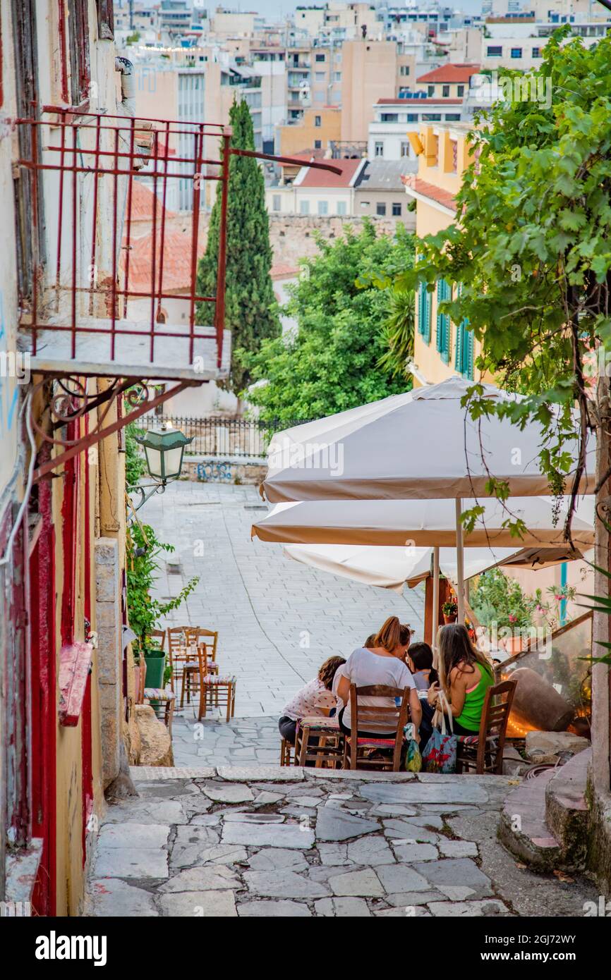 Cafes and tavernas on Mnisikleous Street in the Plaka district, Athens, Greece. Stock Photo