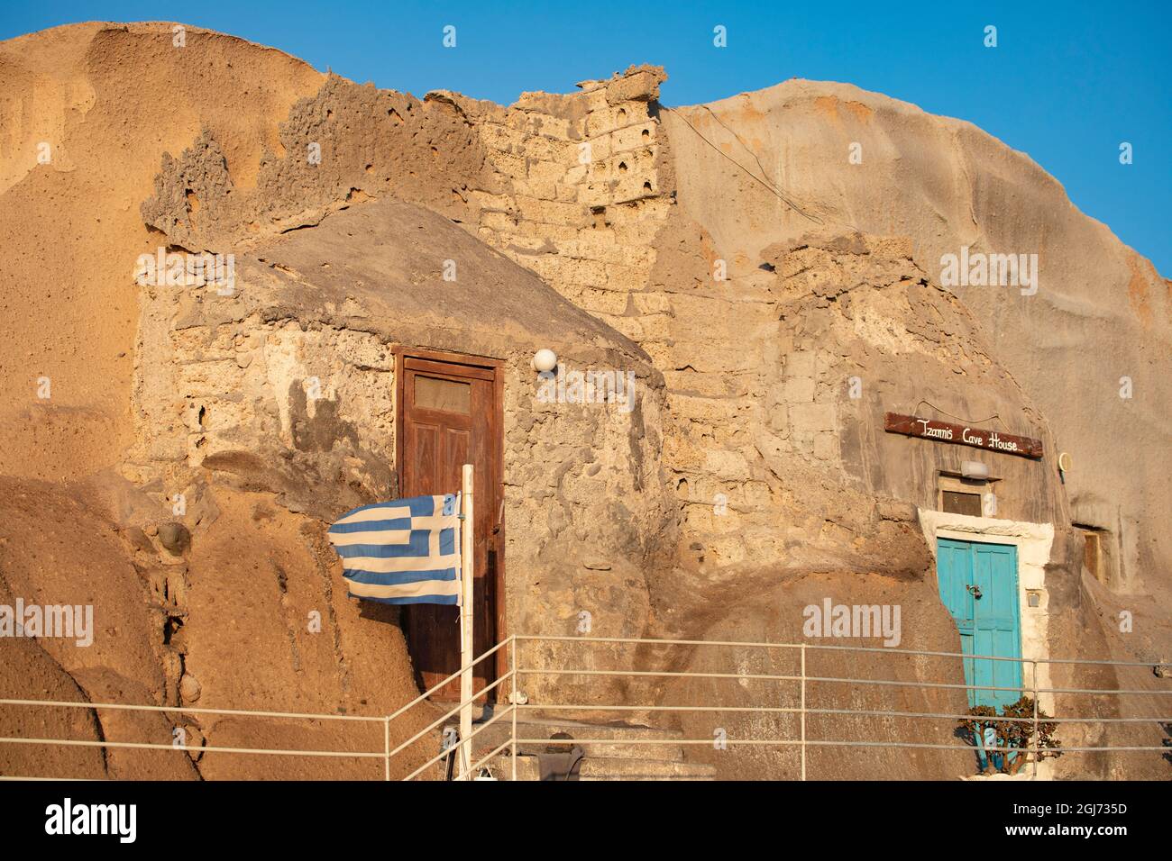 Traditional classic Greek Cave home on beach in Santorini, Greece. Stock Photo