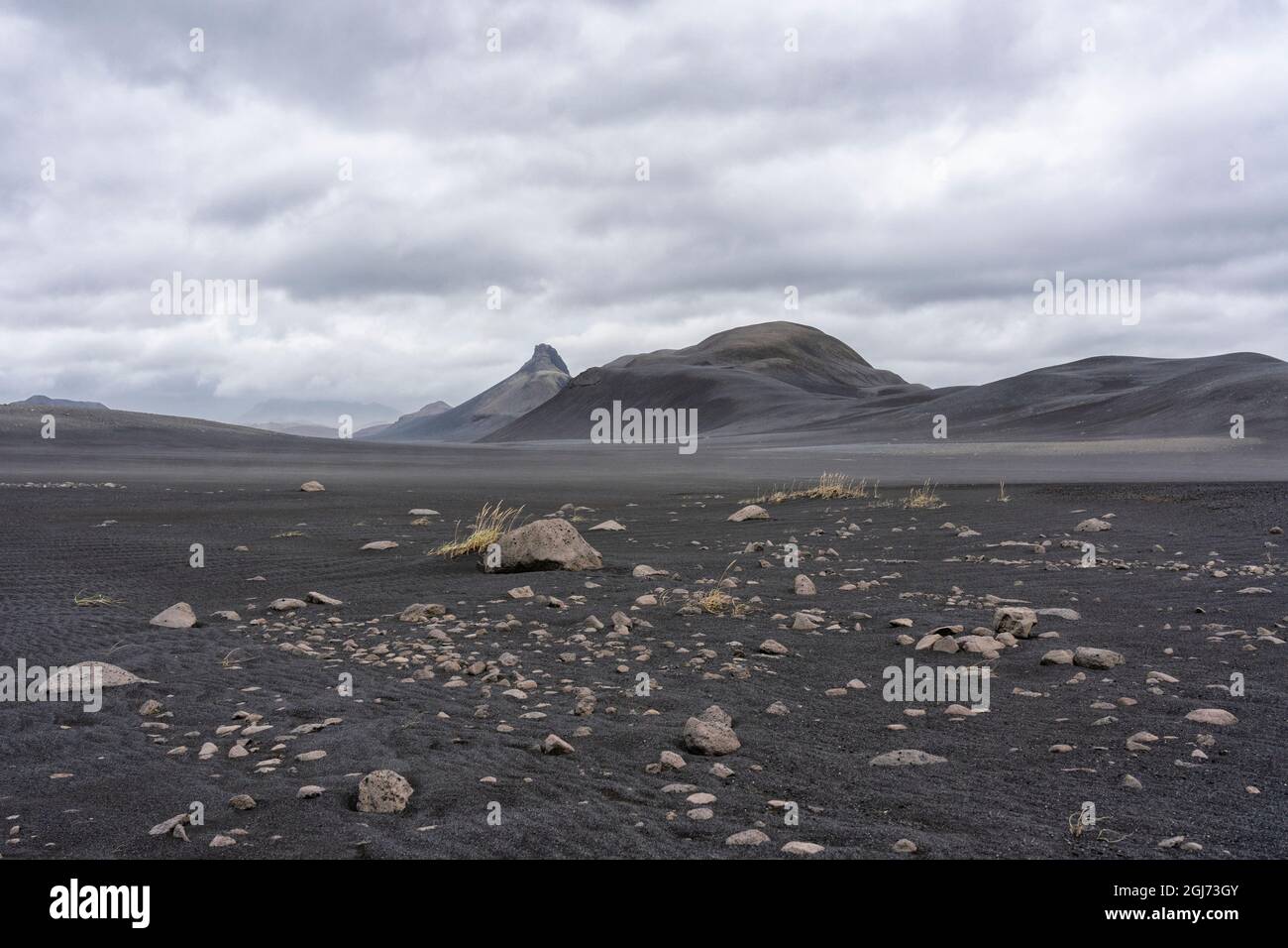 Iceland, Southern Highlands, Hrauneyjar. The black lava dominates the landscape with only sparse bits of grass to break the monotony. Stock Photo