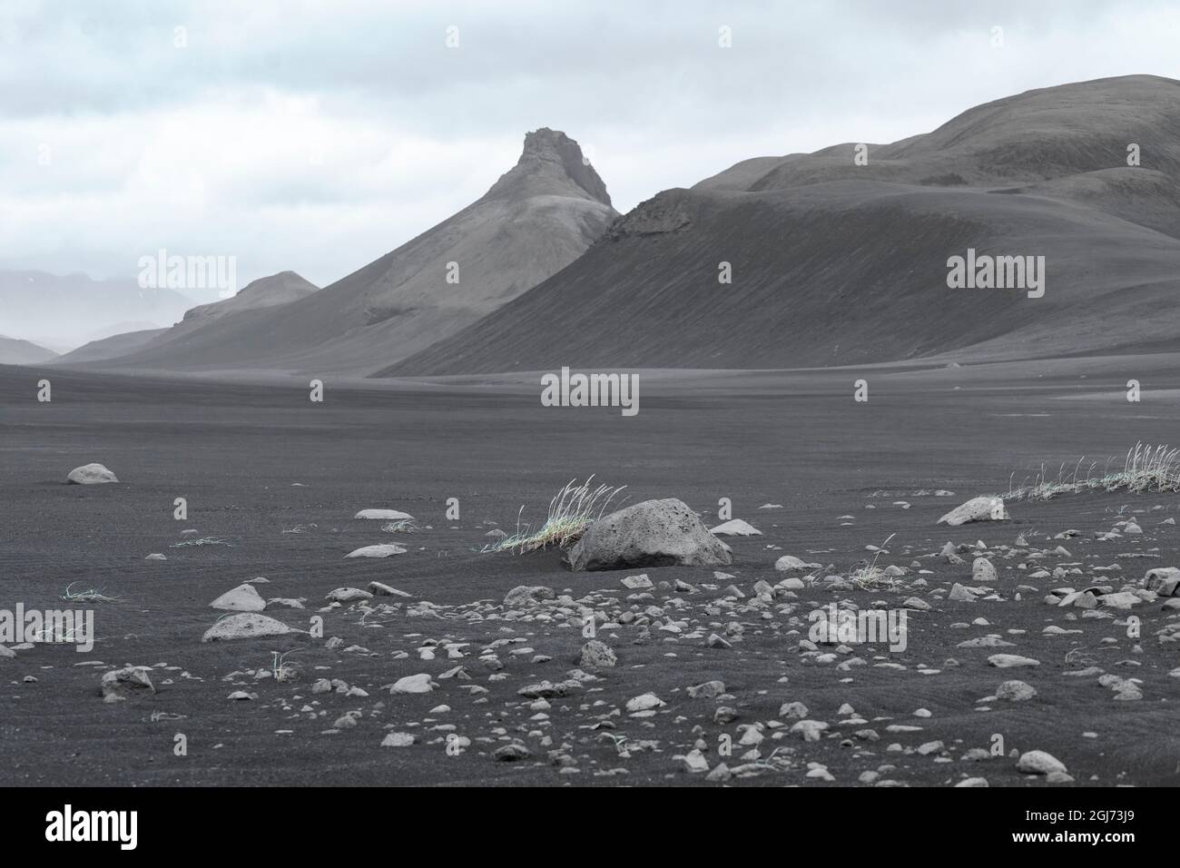 Iceland, Hrauneyjar. The black lava dominates the landscape with only sparse bits of grass to break the monotony. Stock Photo