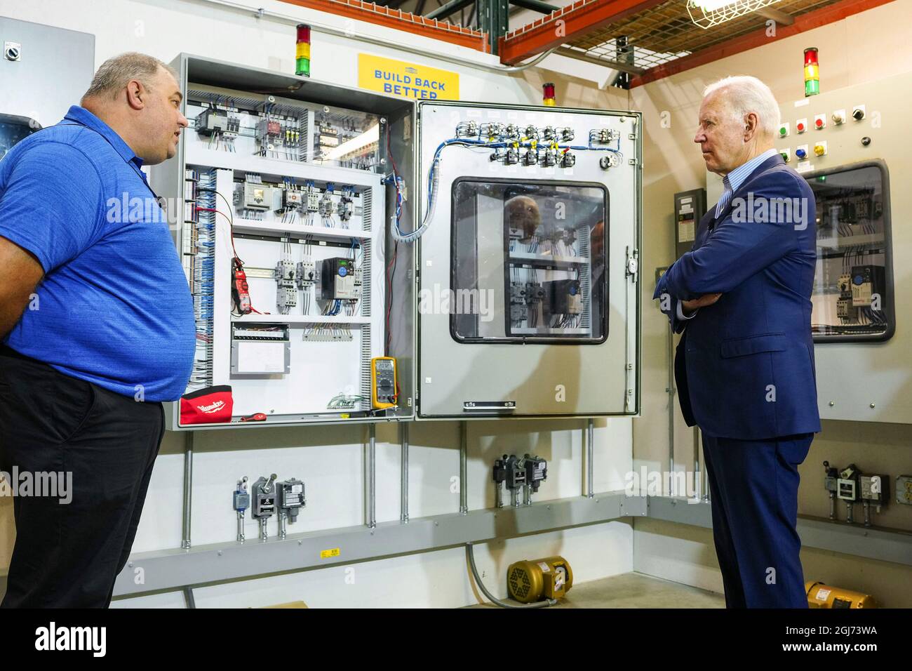 USA. 21st July, 2021. President Joe Biden tours the IBEW/NECA Electrical Training Center in Cincinnati, Wednesday, July 21, 2021, and meets with instructor Robert Guthrie at Stop 1, the motor control system training area. (Official White House Photo by Adam Schultz via Credit: Sipa USA/Alamy Live News Stock Photo